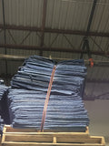 Stack of blue industrial-grade furniture moving covers