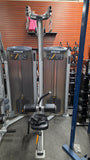  Wide angle of the Precor C002ES lat pulldown in a commercial gym setting highlighting its space-saving footprint.