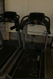 Commercial LED treadmill console showing time, speed, distance, calories, incline,