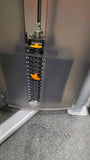 Close-up of the instructional placard on the Precor Vitality machine providing step-by-step guidance on body position.