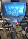 Close-up of the Cybex 770R adjustable recumbent seat with contoured padding and a dual-sided ventilation backrest for commercial gym use