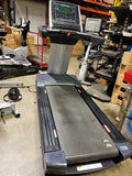 Full front view of the Freemotion t10.9b Commercial Treadmill showing the complete deck and the REFLEX LED console display.