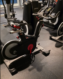 Focus on the Life Fitness IC5 dual-sided pedals with standard toe cages on one side and SPD clips for cycling shoes on the other