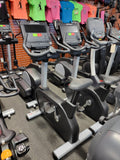  Ergonomic racing handlebars on a Life Fitness Integrity upright bike showcasing the Lifepulse digital contact heart rate hand sensors