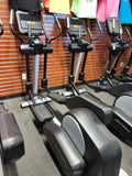 Life Fitness Integrity Series Elliptical Cross-Trainer INX model in premium silver and charcoal finish, shown from a three-quarter angle.