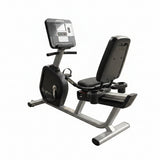 Full side profile view of a titanium storm Life Fitness Integrity Series upright exercise bike featuring a sleek, industrial frame and an adjustable race seat.