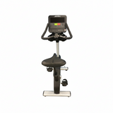 Remanufactured Life Fitness Integrity Series commercial upright stationary bike with a silver frame, Comfort Curve seat, and racing handlebars.