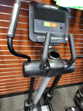 Close-up of the Life Fitness Integrity INX elliptical touchscreen console displaying workout metrics and entertainment options.