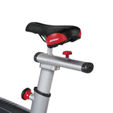  Profile view of the Life Fitness LifeCycle GX Indoor Cycle showing the rust-resistant steel frame, multi-ribbed belt drive, and adjustable racing-style handlebars