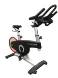 A high-performance Life Fitness LifeCycle GX Indoor Cycle with a rear-drive flywheel and dual-sided SPD pedals, ideal for home or commercial gym use.