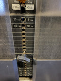 Close-up of the 400lb shrouded weight stack and easy-to-reach selector pin adjustment for the Precor Discovery line.
