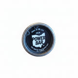 Rogue Ohio Power Bar showing 29mm shaft and aggressive center knurl with dual powerlifting marks, 205k PSI tensile strength