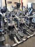 Top-down detailed view of the oversized 15-inch by 7-inch rubber Bio-Flex orthopedic footplates on a SCIFIT SXT7000 elliptical, emphasizing the raised safety edges.