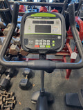 Ergonomic multi-position handlebars on a SportsArt C535U stationary bike highlighting the integrated metallic contact heart rate pulse plates.