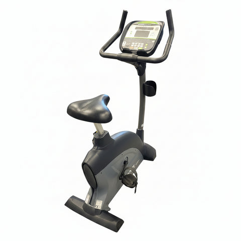 Profile view of a self-powered SportsArt C535U commercial upright cycle featuring a silver steel frame, low step-through shroud, and black console.