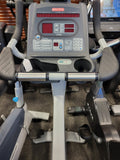 Close-up of the digital console and workout display screen on a Star Trac Pro upright bike.