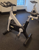 Detailed view of the Technogym D92 Poly-V belt drive system designed for smooth, quiet, and maintenance-free indoor cycling.