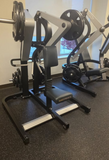 Close-up of the diverging motion arms on the Technogym Low Row designed to follow the natural path of muscle movement.
